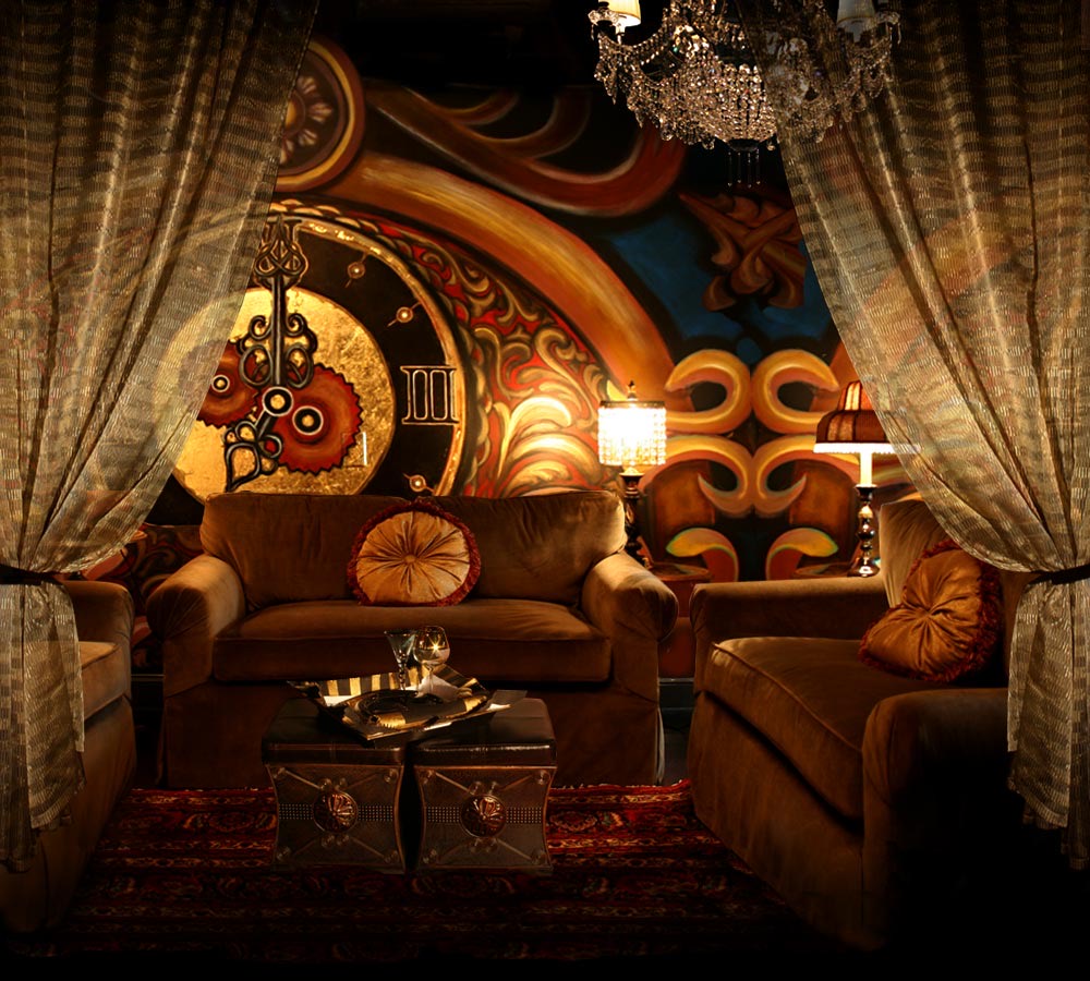 A curtained lounge with velvet sofas beneath a hand-painted mural and crystal chandelier
